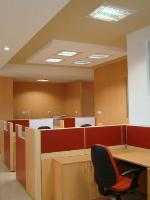 the main theme has been done with light coloured wood grain laminate with colourful accents  in the partitions and ceiling.